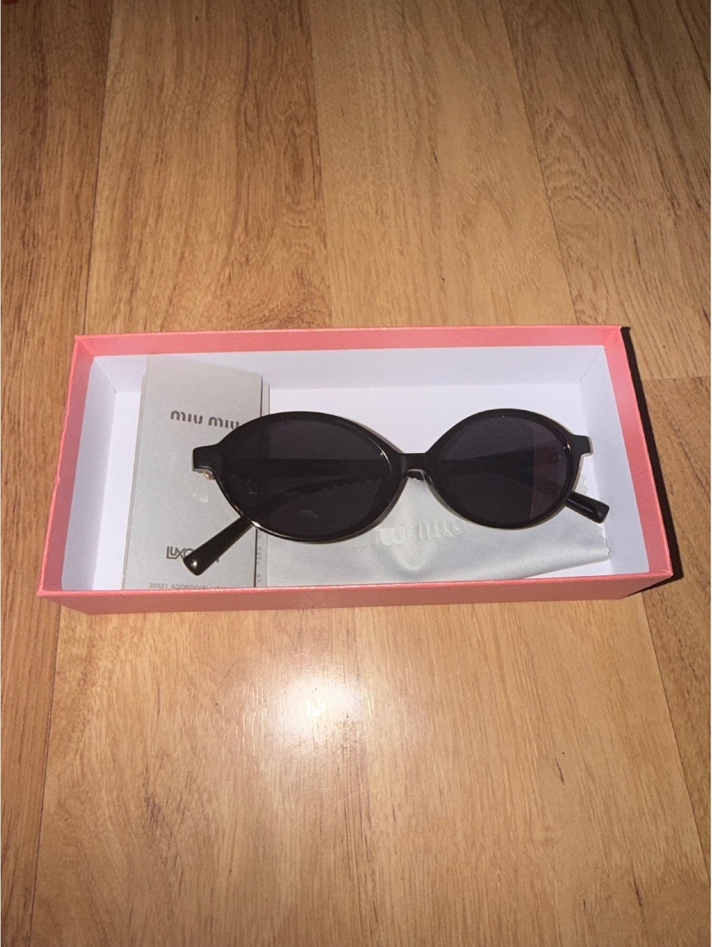Miu Miu "Miu Regard" Black Sunglasses